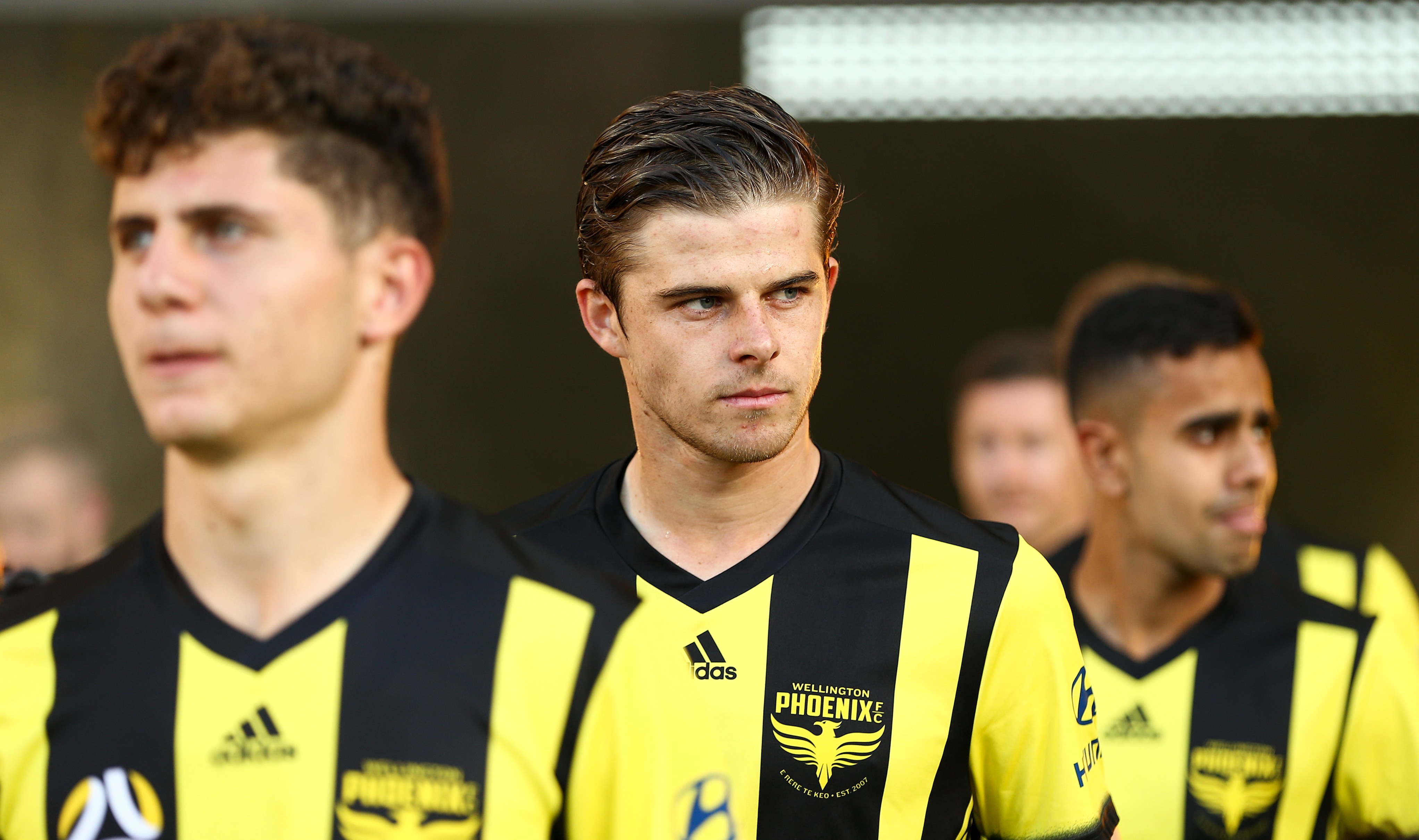 Alex Rufer, of the Wellington Phoenix leads the team out during