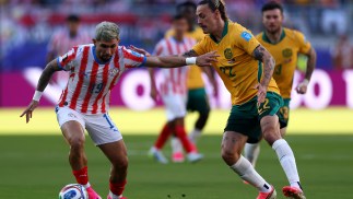Socceroos qualify for Round of 32 after battling draw with Paraguay